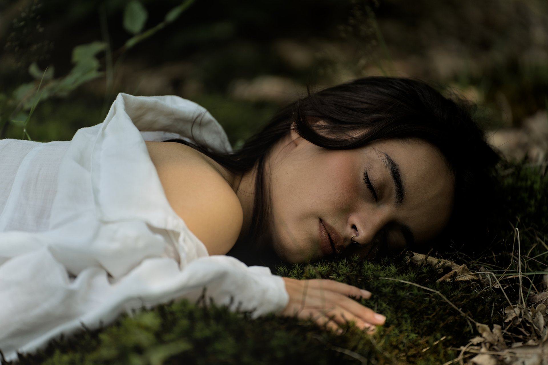 Conceptual portrait of a woman in soft natural light, evoking self-discovery and emotional depth
